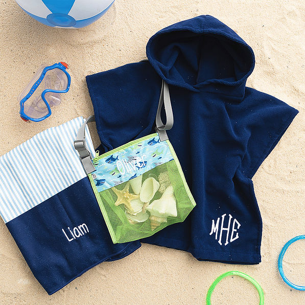 Sharks seashell bag with towel on sand