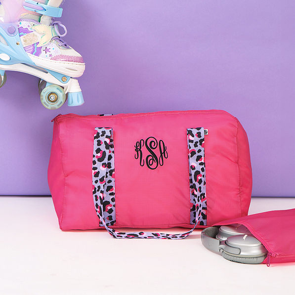hot pink kids activity bag with roller blades