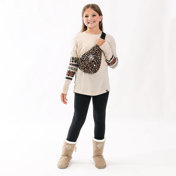 kids monogrammed sling pack in cheetah on girl with long sleeve shirt