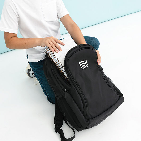 black sp25 backpack with notebook