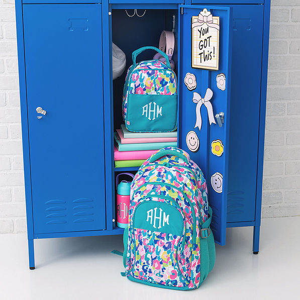 monogrammed watercolor cheetah matching lunch box and backpack in locker