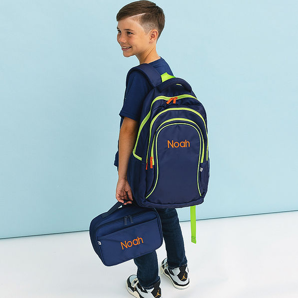 navy personalized matching backpack and lunch box held by boy
