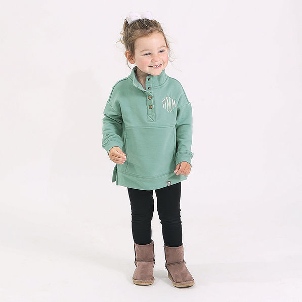 toddler in sage sweatshirt and leggings