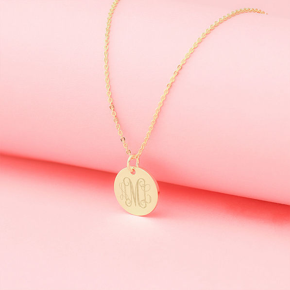 gold kids disc necklace with pink background 2024