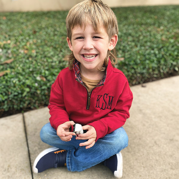 boy wearing red plaid monogrammed quarter zip sweatshirt