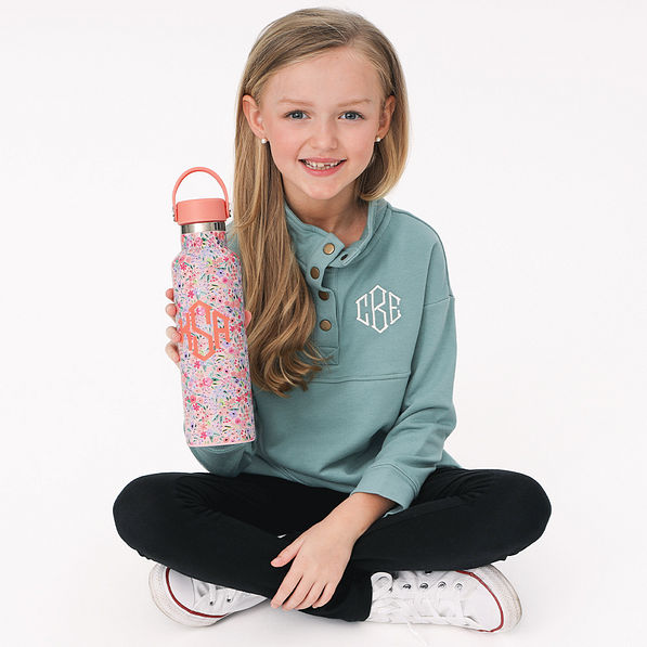 girl holding coral floral monogrammed kids water bottle