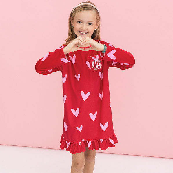 girl wearing monogrammed red hot hearts nightgown close up