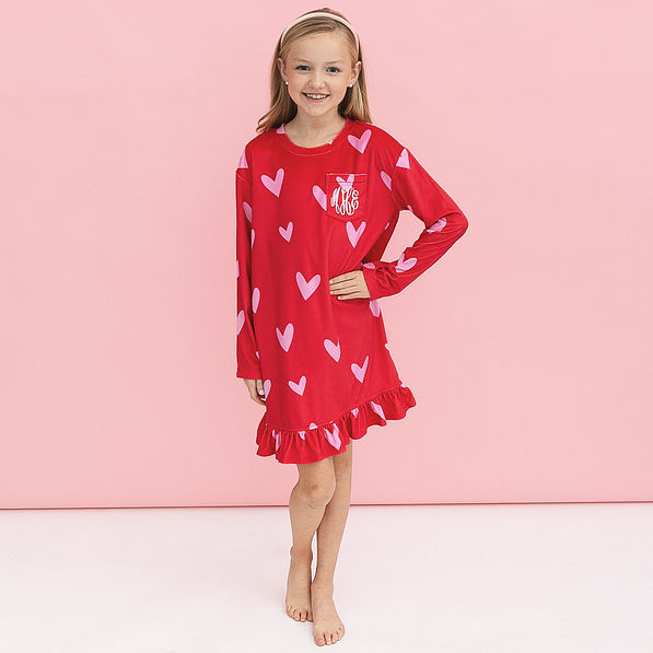 girl wearing red hot hearts nightgown
