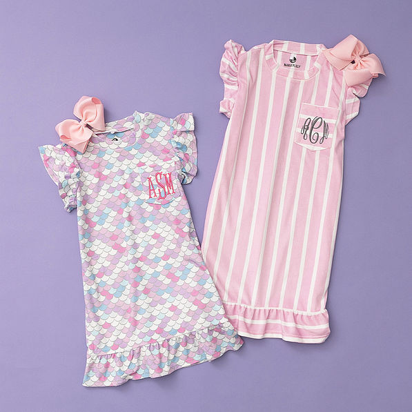mermaid and pink and white nightgowns flatlay