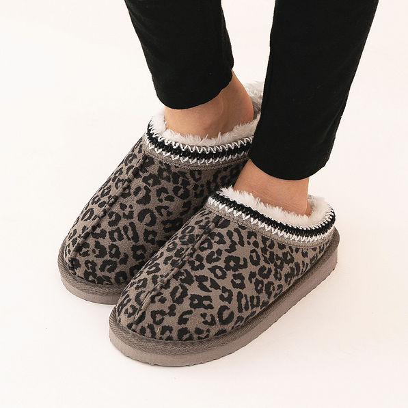girl wearing leopard print moccasins