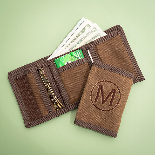 brown kids wallet on green background