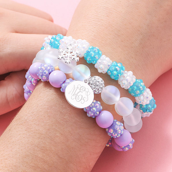 ​​girls snowflake monogrammed bracelets on wrist