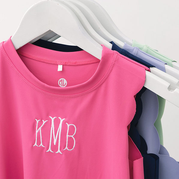 close up of personalized girls scallop dress in hot pink