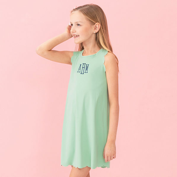 girl wearing personalized mint scallop dress