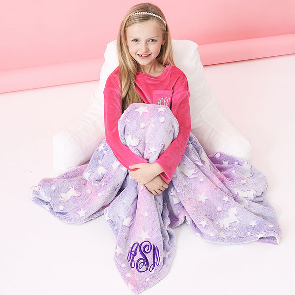 unicorn pink and purple monogrammed blanket over girl