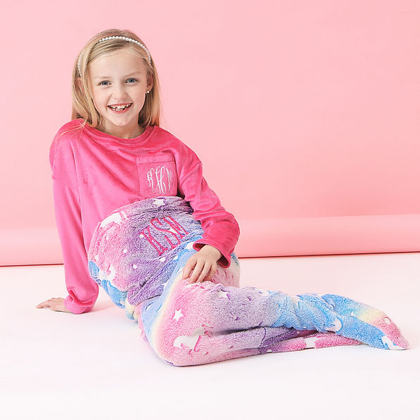 girl wearing personalized mermaid tail blanket
