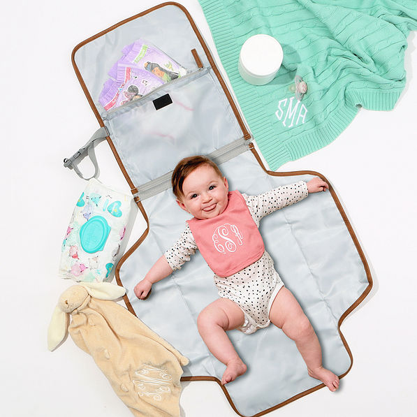 black sassy spots baby changing pad with baby