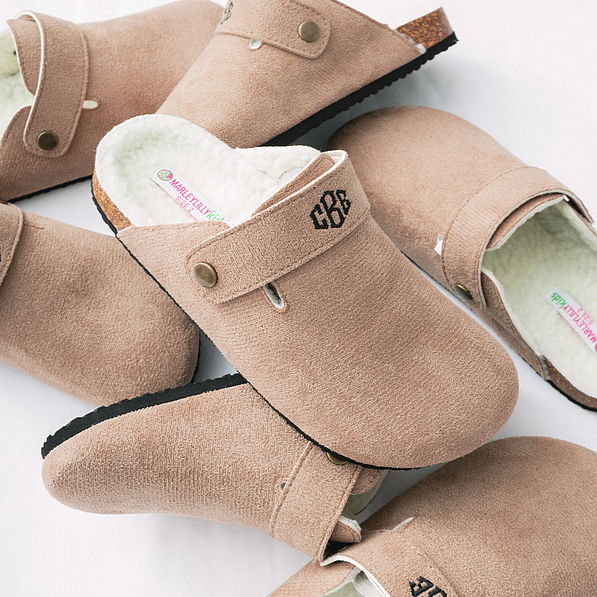 close up of monogrammed kids clogs