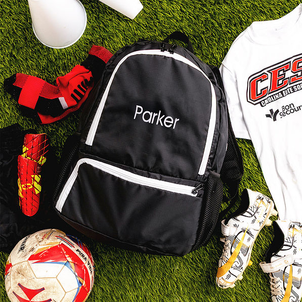 kids black activity backpack on grass