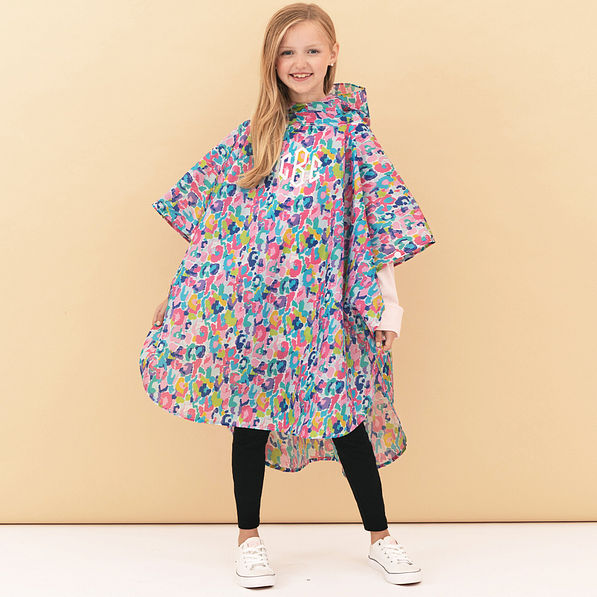 girl wearing watercolor cheetah kids monogrammed rain poncho