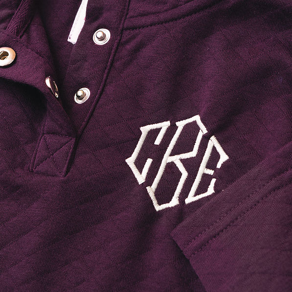 close up of plum kids monogrammed quilted pullover
