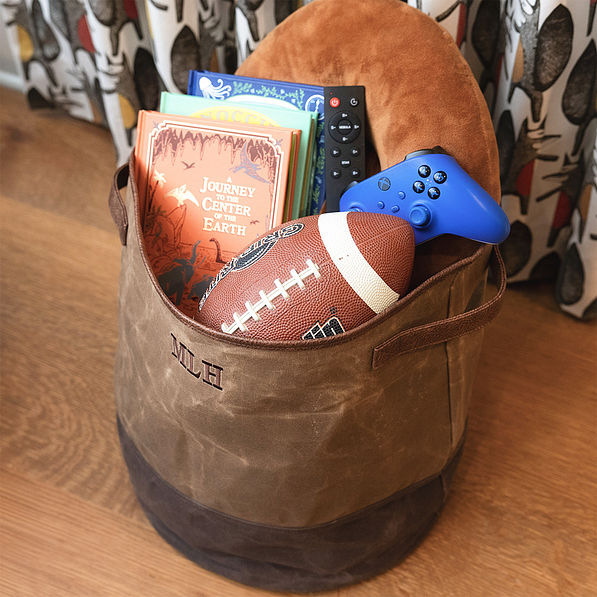 kids waxed canvas storage basket with toys and books