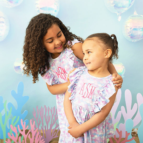 mermaid ruffle dress close ups of two girls
