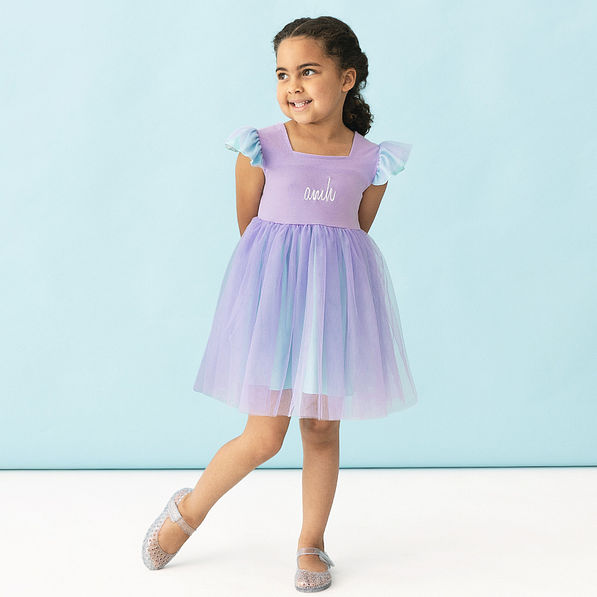 girl wearing purple and blue monogrammed twirl dress