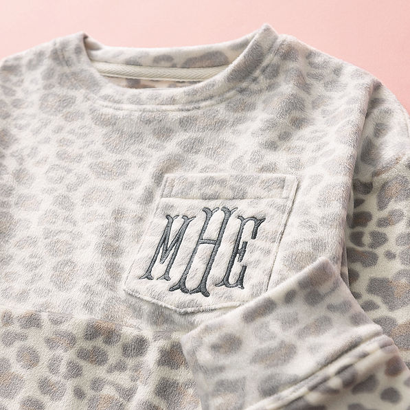 close up of kids snow leopard monogrammed pullover