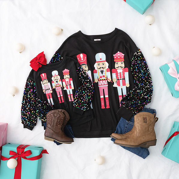 black nutcracker sweatshirt mom and me flatlay