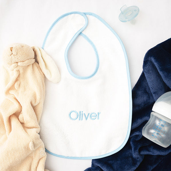 light blue outline baby bib flatlay