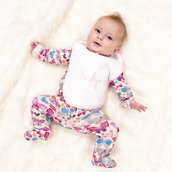 pink outline baby bib on baby