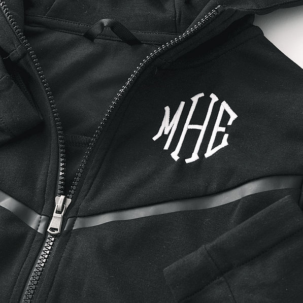 close up of monogrammed black full zip hoodie