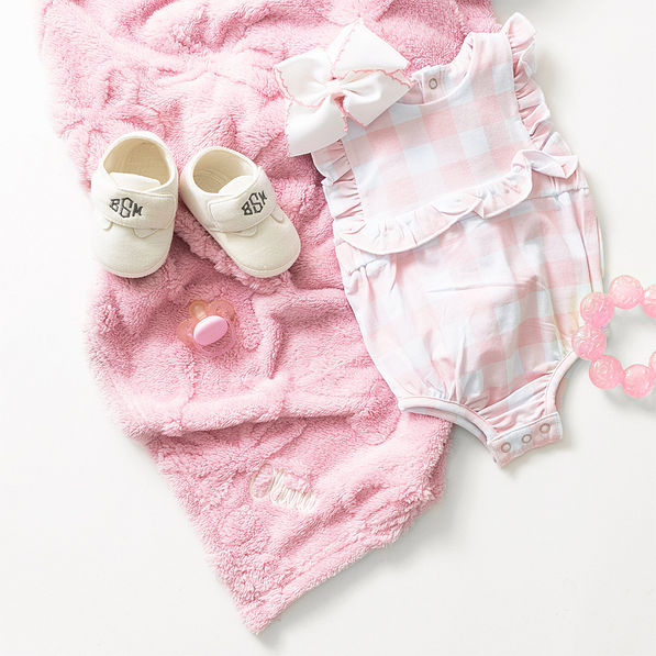 pink baby bow blanket flatlay