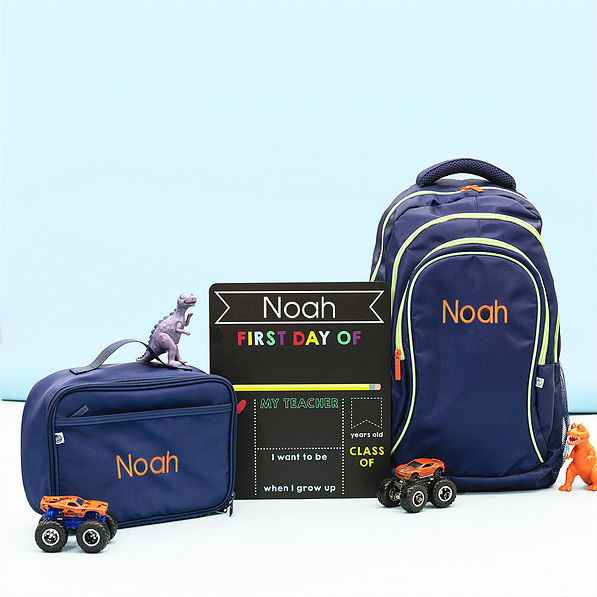 back to school chalkboard with navy bags