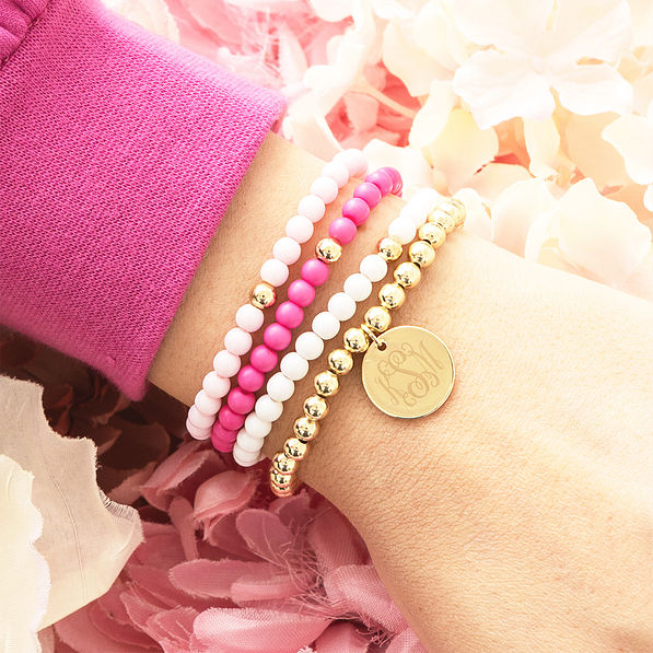 girls pink beaded bracelet stack on arm