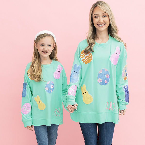 close up of mom and mini monogrammed easter sweatshirts