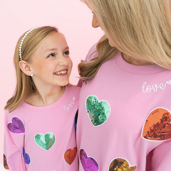 close up of mom and me sequin hearts sweatshirts