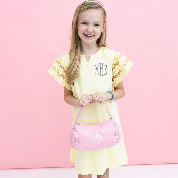 pink girls shoulder bag in hands