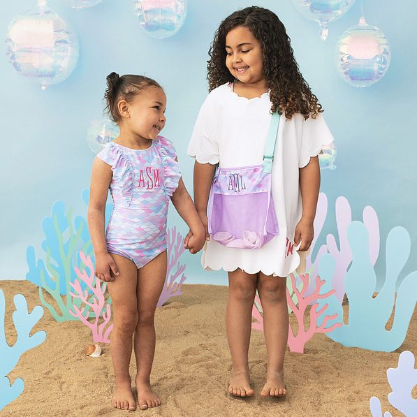 girls wearing monogrammed bathing and scallop cover up in white