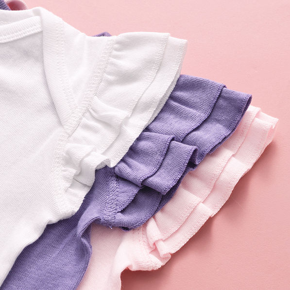 close up of flutter sleeve bodysuits in white light pink lavender