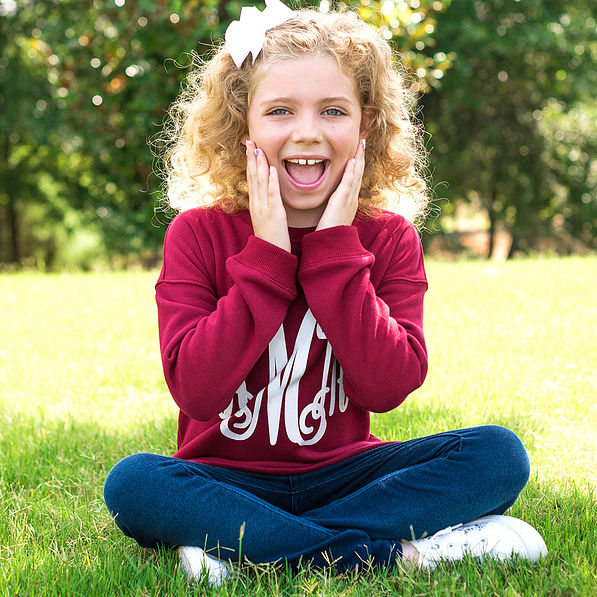 girl wearing burgundy monogrammed crewneck