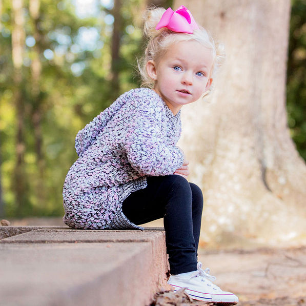 cute girl wearing hoodie and bow