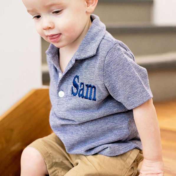 little boy in blue polo