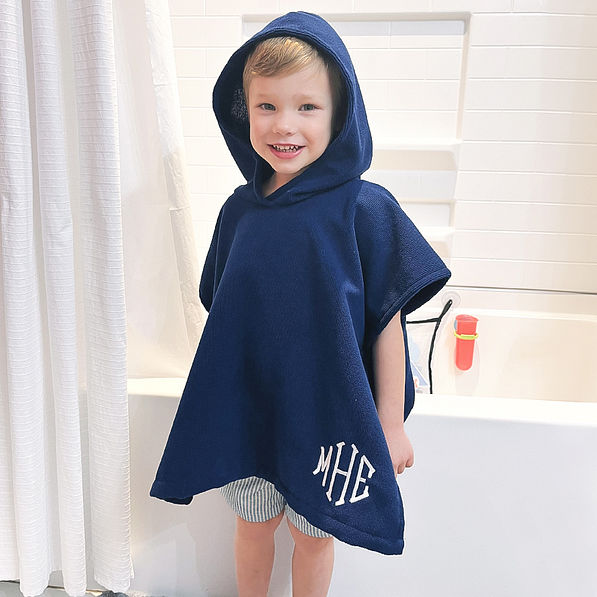 boy in navy monogrammed toddler hoooded poncho