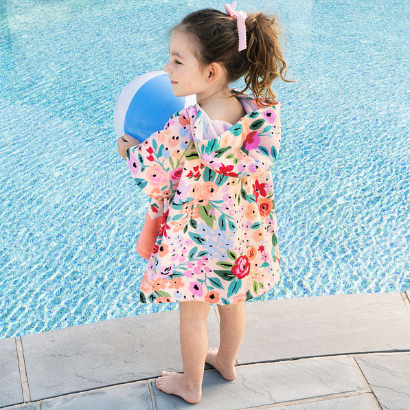 back of monogrammed toddler hooded poncho in coral floral