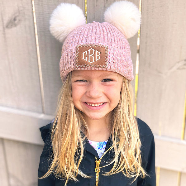 pink pom pom beanie on little girl