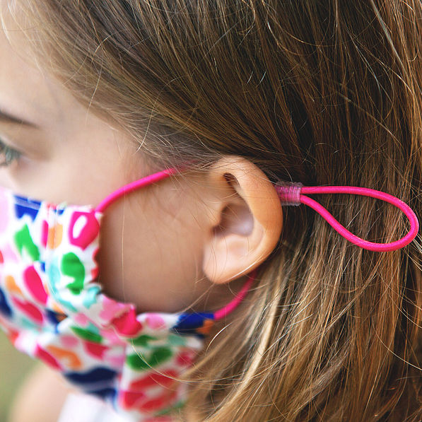 little girl in adjustable face mask