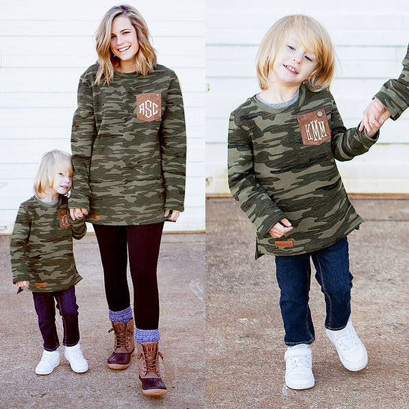 mom and son holding hands wearing camo sweatshirts