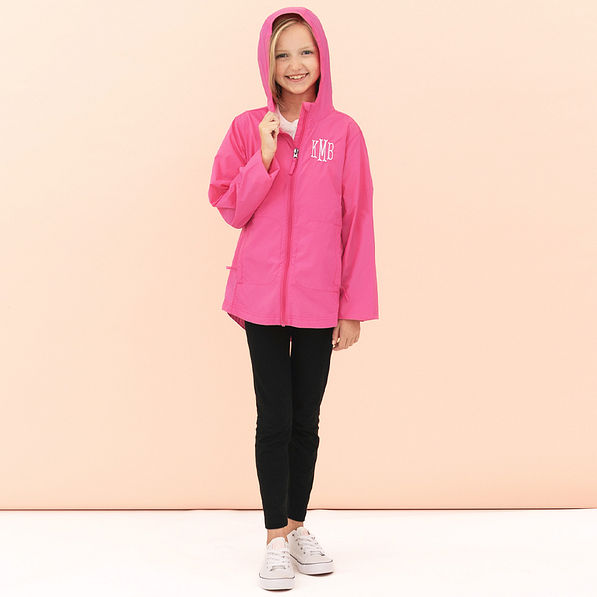 girl wearing hot pink monogrammed lightweight rain jacket with hoodie